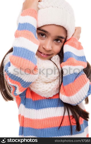 Little girl posing in winter clothes over white