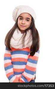Little girl posing in winter clothes over white
