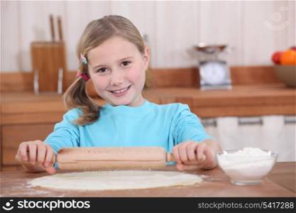 little girl preparing tart