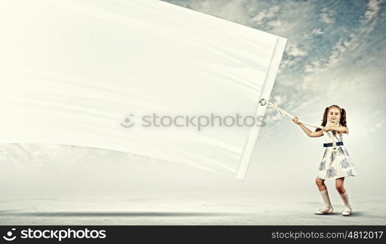 Little girl pulling banner. Little pretty girl pulling blank banner. Place for text