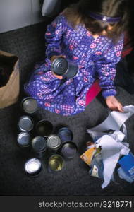 Little Girl Recycling Cans