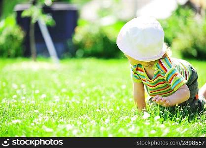 little girl relaxing on grass