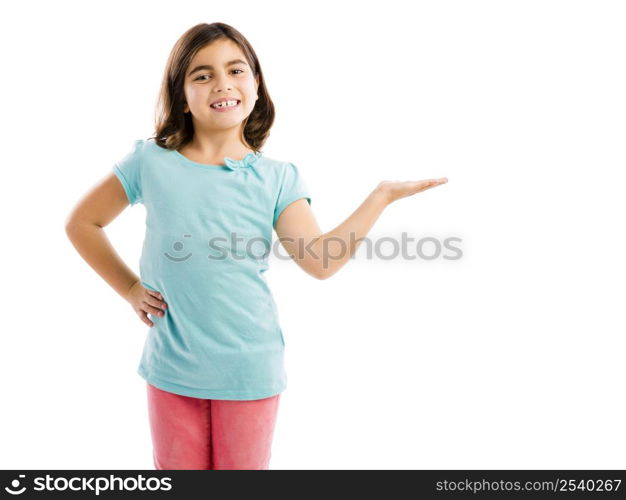 Little girl showing something over her hand, isolated in white background