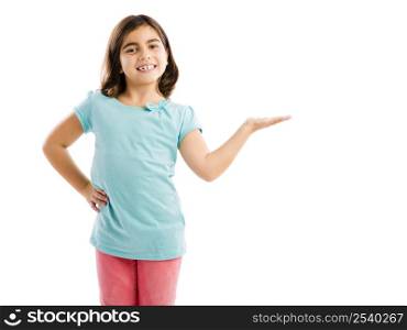 Little girl showing something over her hand, isolated in white background