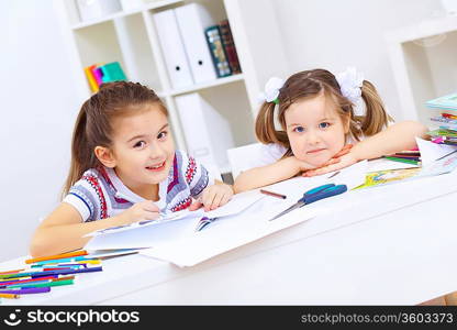 Little girl sitting and studying at home