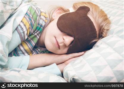 little girl sleeping in sleep mask. sleep and health