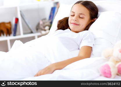 Little girl sleepng in her bed at home