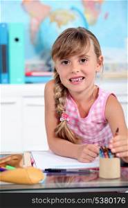 Little girl smiling in classroom