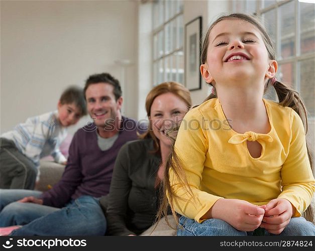Little Girl Smiling With Family