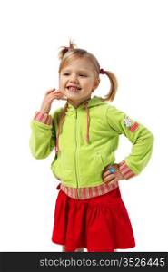 little girl stands near a wall, red skirt, green woman&rsquo;s jacket, white background, pigtails