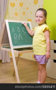 Little girl studying at home