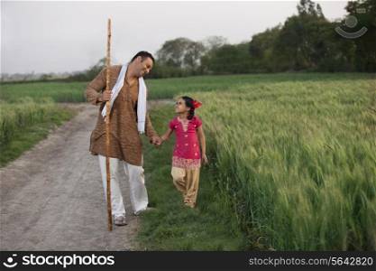 Little girl taking a walk with her father