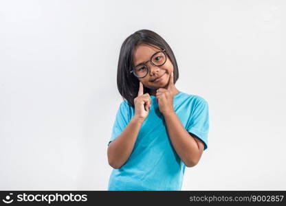 Little girl thinking in studio shot