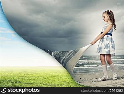 Little girl turning page