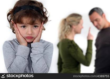 Little girl upset by parents arguing