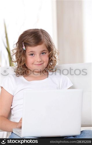 Little girl using a laptop