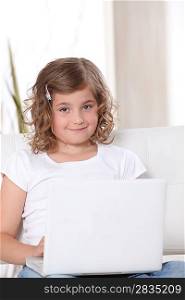 Little girl using a laptop