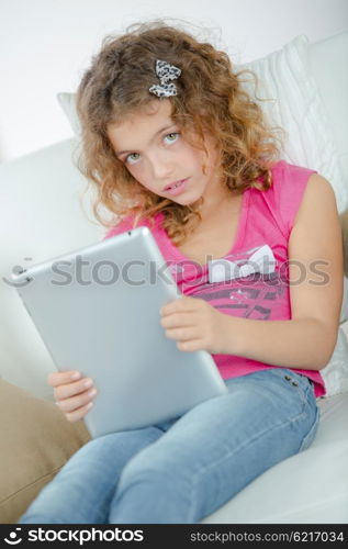 Little girl using her new tablet computer