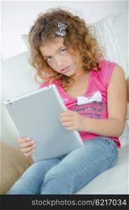 Little girl using her new tablet computer