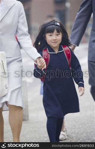 little girl walking to school