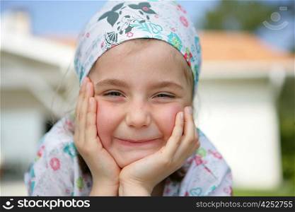 Little girl wearing a bandanna
