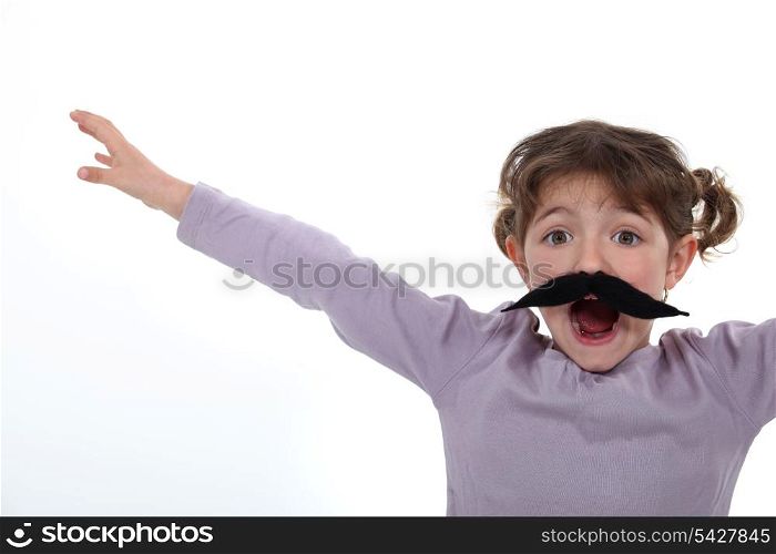 Little girl wearing a fake moustache