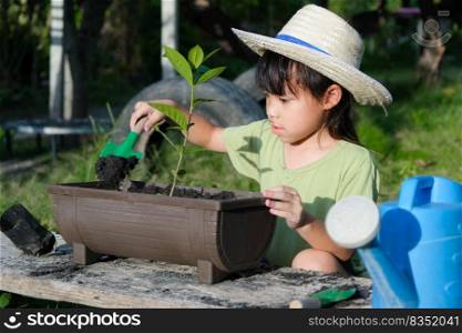 Little girl wearing a hat helps her mother in the garden, a little gardener. Cute girl planting flowers in pots for sale. family small business
