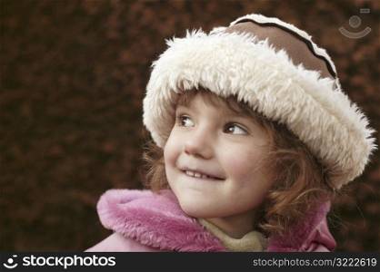 Little Girl Wearing Fake Fur Hat