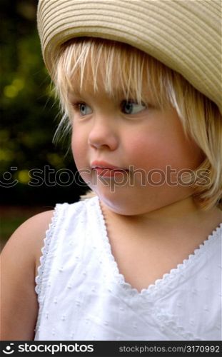 Little Girl Wearing Straw Hat