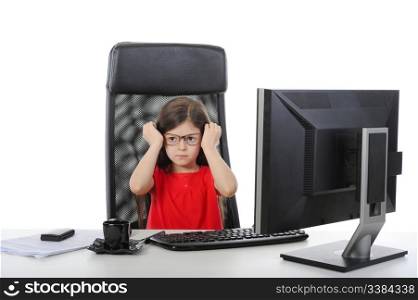 little girl wears glasses at the table in front of a computer. Isolated on white background