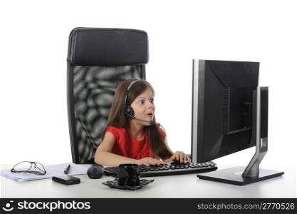 Little girl with astonishment looks in the computer monitor. Isolated on white background