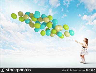 Little girl with balloons. Image of little cute girl with bunch of color balloons