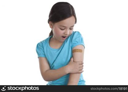 Little girl with band-aid on arm