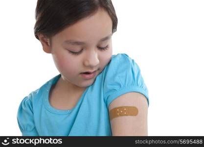 Little girl with band-aid on arm