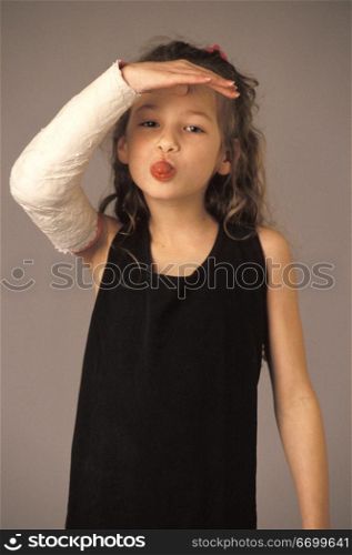 Little Girl With Cast Sticking out her Tongue
