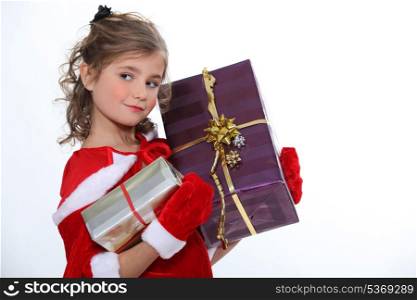Little girl with Christmas gifts