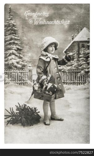 Little girl with christmas tree, gifts and vintage toys. Antique picture with original film grain and scratches