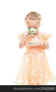 Little girl with cup of tea isolated on white