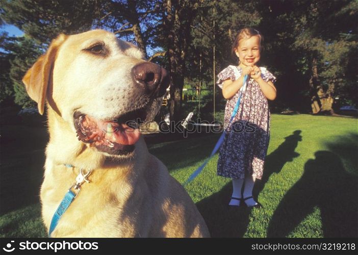 Little Girl With Dog on Leash