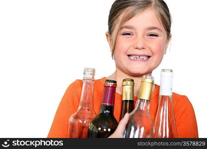 Little girl with empty bottles