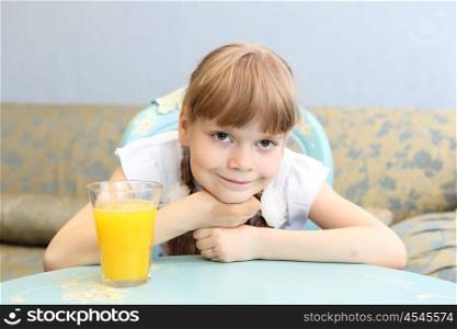 little girl with glass of orange juice
