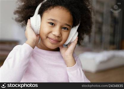 little girl with headphones 3