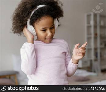 little girl with headphones 4