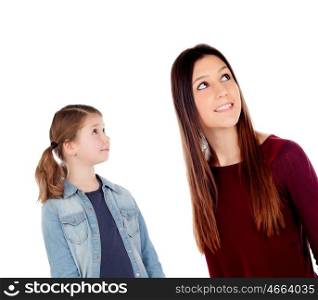 Little girl with her mother looking up isolated on a white background