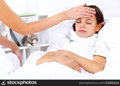 Little girl with illness at bed at home