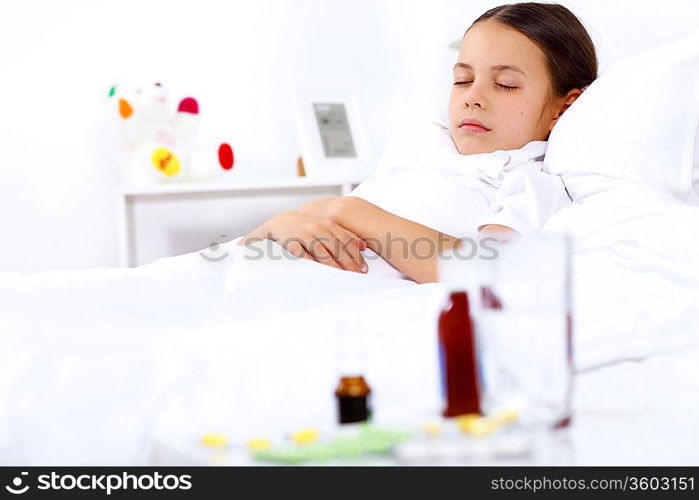 Little girl with illness at bed at home