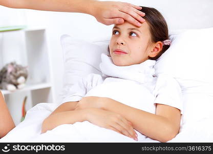 Little girl with illness at bed at home