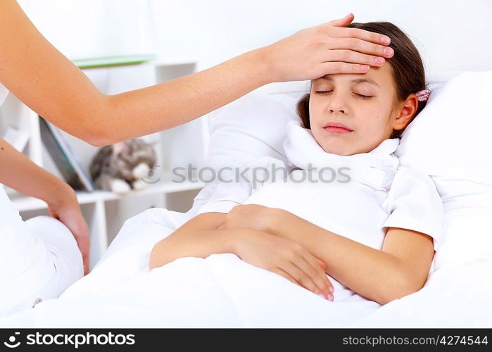 Little girl with illness at bed at home