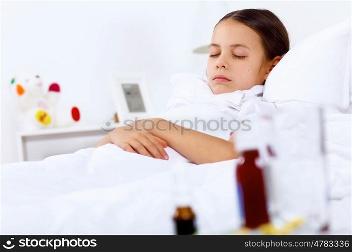 Little girl with illness at bed at home