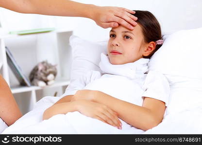 Little girl with illness at bed at home